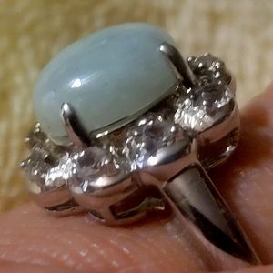 Sterling silver .925 ring with light opaque blue stone and diamonique stones